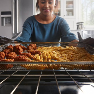 Person putting food in the oven